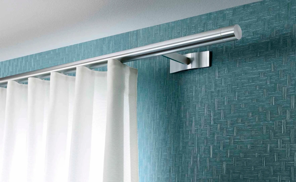 Sistema de riel para cortinas pesadas y grandes ventanales